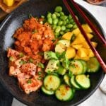 close up of a spicy tuna crispy rice salad bowl with dressing on top