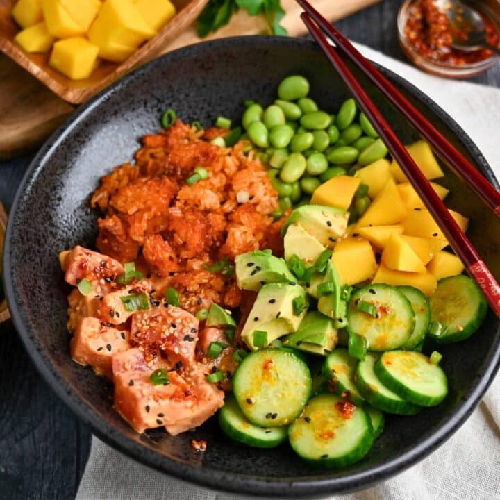 a crispy rice salad with spicy tuna with chopsticks