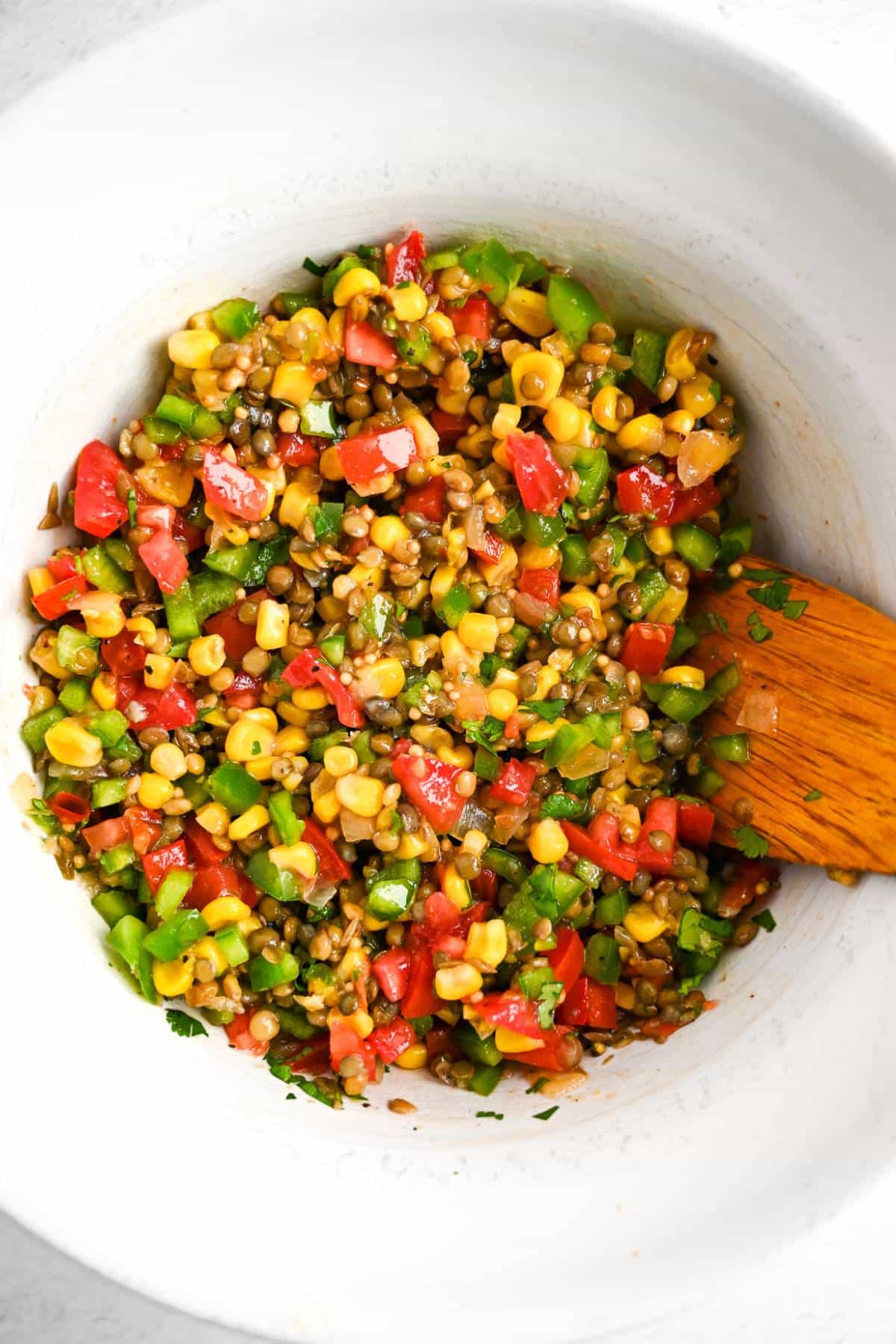 bean and corn salsa tossed in a large mixing bowl