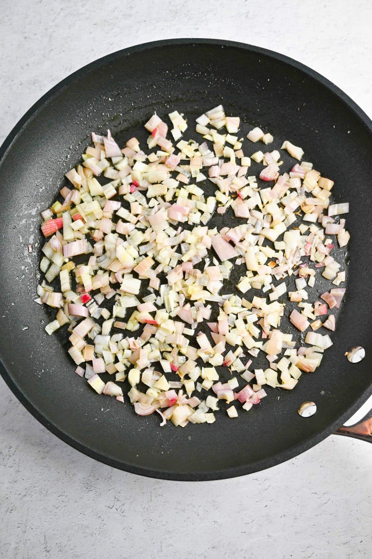 sauteed shallots in a skillet