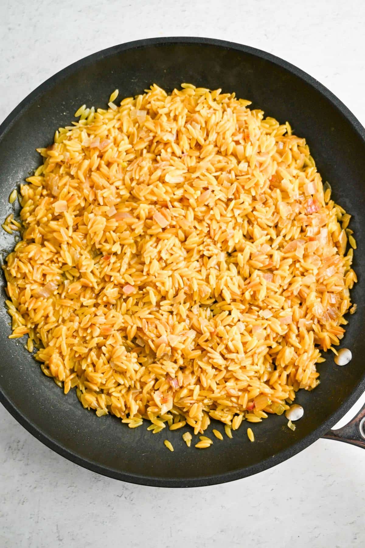 cooked orzo in a skillet