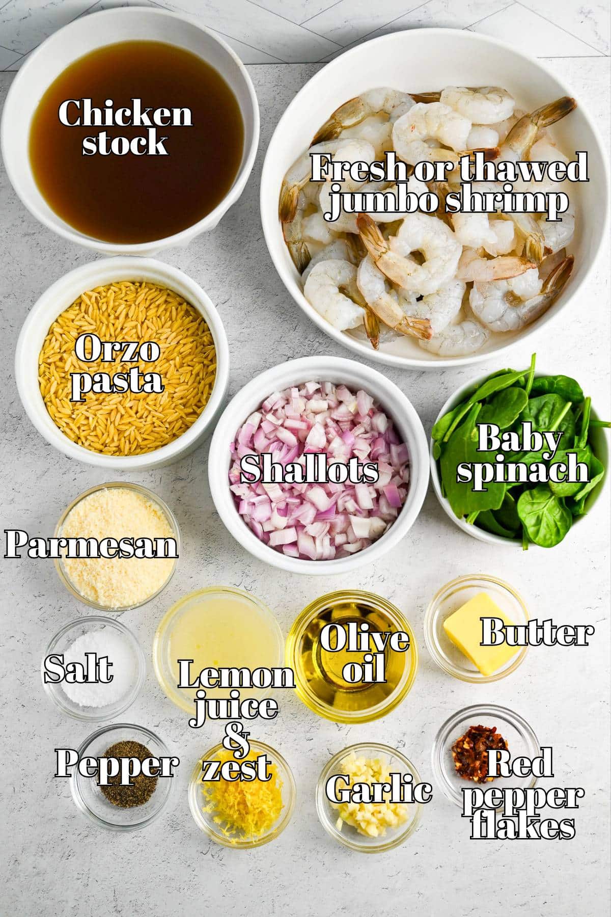 ingredients to make a lemon shrimp and orzo skillet measured out on a counter