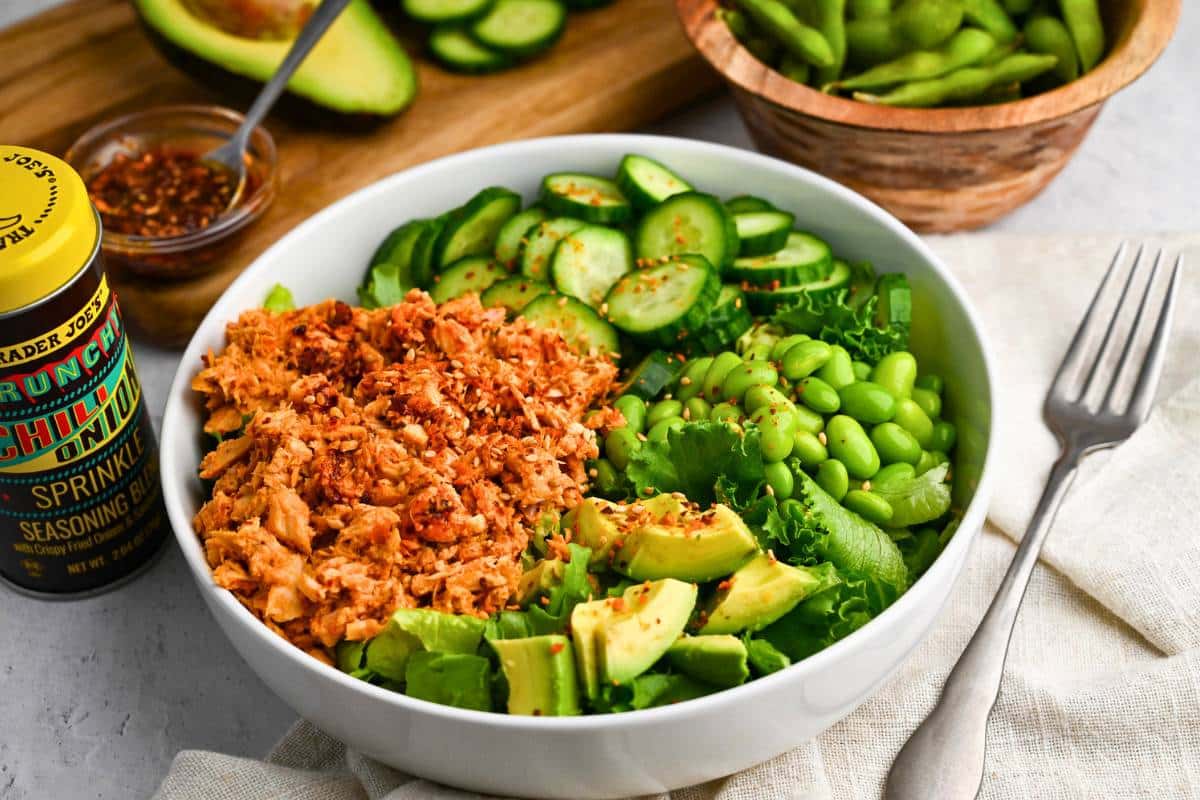  canned spicy tuna with chopped cucumbers, avocado, lettuce, and edamame