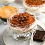 a tiramisu parfait with chocolate shavings on top