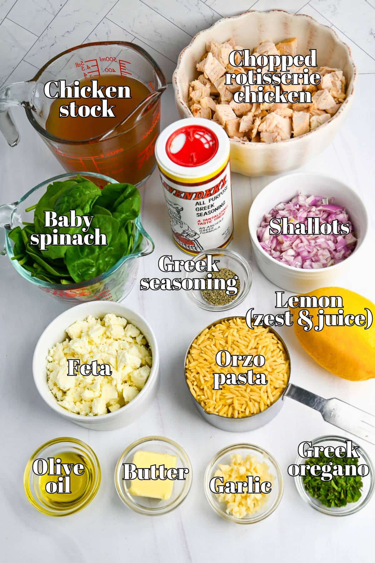 ingredients for a greek orzo chicken skillet measured out on a counter