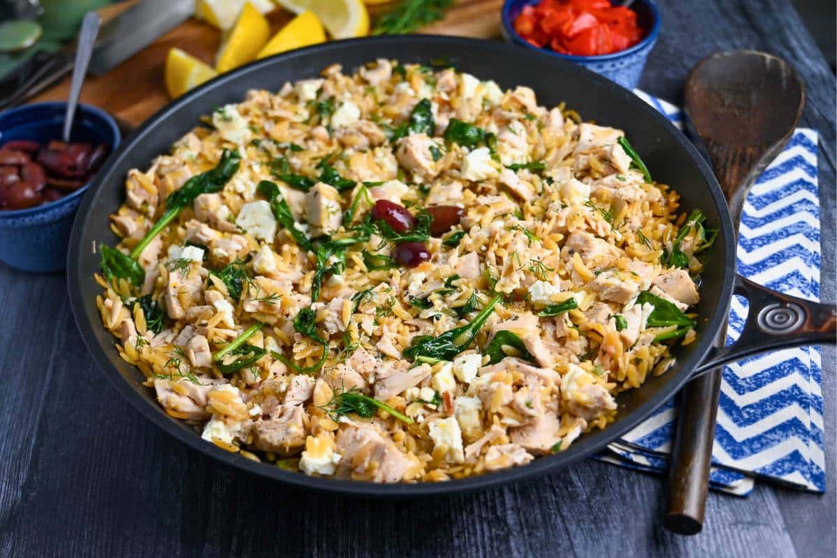 side view of a high protein Greek chicken orzo skillet 