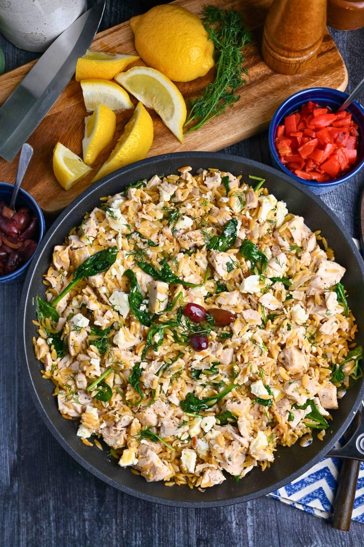 looking down at a finished Greek-inspired lemon chicken orzo skillet made with short-cut rotisserie chicken