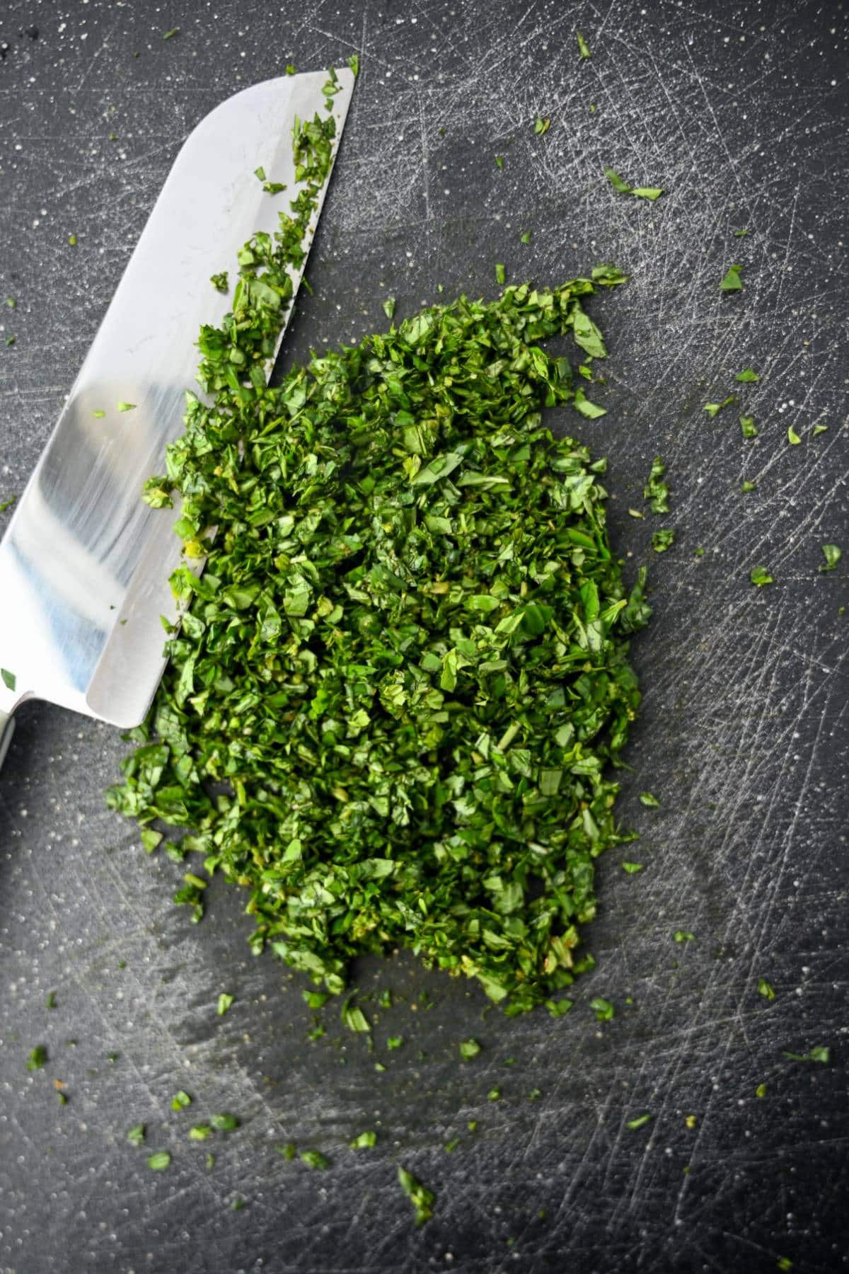 chopped fresh basil on a cutting board